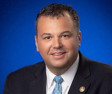 A photo of Senator JB Jennings with a blue background.